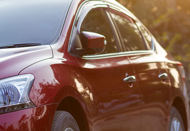 Side of new model red car | Auto Insurance